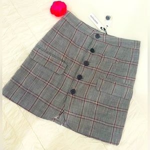 NWIt plaid skirt by Olivaceous with buttons up front and two pockets size M